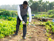 © JackF - Man working soil with hoe