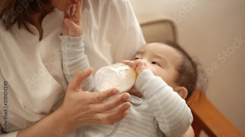 Mother Feeding Milk To Her Baby Boy At Home 4k Vimeo Stock