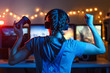 © Anton - Gaming and e-sports. Girl gamer, streamer playing games using the joystick and gamepad. On three monitors, Creative light