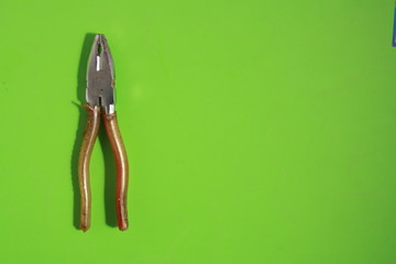 old pliers in color background