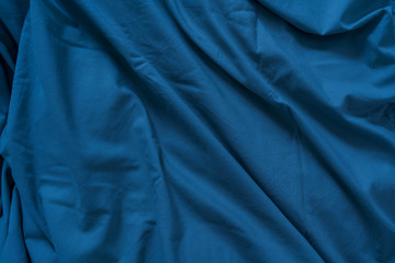 Color fabric drapery textile background of the blue classic color of the 2020 year.