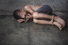 Victim Boy With Hands Tied Up With Rope In Emotional Stress And Pain,  Kidnapped, Abused, Hostage,  Stop Abusing Violence, Children Violence And Abused Concept
