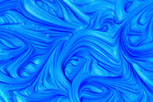 Close Up Liquid Luxury Blue Metallic Glitter Paint Swirls To Make An Abstract Textured Background