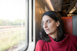 © acinquantadue - Girl on the train looking outside the window