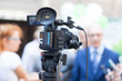 © Mihajlo Maricic - Filming media event with a video camera. News or press conference.