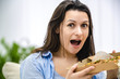 © Andrii - Satisfied and happy woman is ready to enjoy pizza. Close up. Copy space.