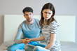 © SHOTPRIME STUDIO - young couple sitting on couch