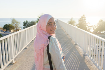 Wall Mural - Muslim girl on sea coast