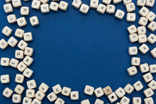 Wooden Letter Blocks Over Blue Background, Top View. Copy Space.