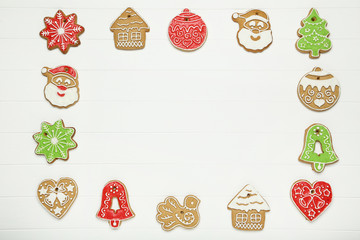 Wall Mural - Christmas gingerbread cookies on white wooden table