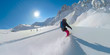 LENS FLARE: Young woman shreds the cold smoke snow while heli boarding in Canada