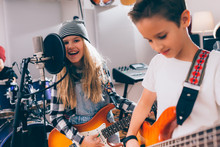 Kids Rock Band Practice In Music Studio