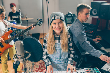 Wall Mural - kids rock band practice in music studio