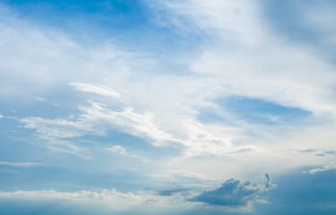 Wall Mural - Background of white cumulus clouds on a blue sky at daylight. Telephoto zoom shoot