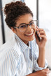 © Drobot Dean - Close up of a smiling young african business woman
