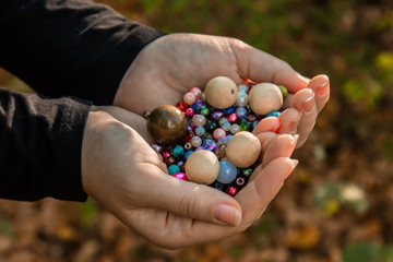 Large wooden bead beads in the palms. Blanks for needlework.