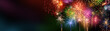 Colorful fireworks with wide dark copy space