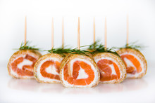 Rolls Of Pancakes Filled With Smoked Salmon, Cream Cheese Decorated With Dill. Snacks. Isolated.