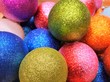 © Tetiana Ivanova - Beautiful Colorful shiny Christmas ball background. Top view. New year decoration. Christmas background with shiny decoration balls. Sparkling decoration balls for new year tree. Selective focus
