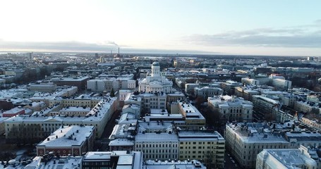 Wall Mural - Scenic winter footage of the Old town. Cathedral at sunset in Helsinki, Finland. Snow on the roofs.