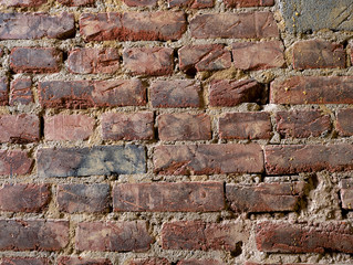 Wide red brick wall texture. Old rough orange brickwork widescreen backdrop. Grunge panoramic large background.