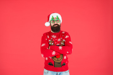 Wall Mural - Come get ready for Christmas. bearded man santa hat red wall. christmas time. male xmas party glasses. happy new 2020 year. funny hipster knitted sweater. knitwear fashion. winter holiday celebration