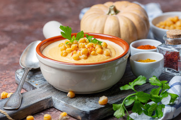 Wall Mural - Spicy pumpkin cream soup with chickpeas.