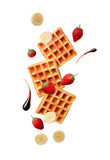 Fototapeta  - Belgium waffles with strawberries and banana