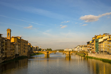 Wall Mural - Scenic view of the Arno River with the Ponte Santa Trinità bridge and the bell tower of the Basilica of Santo Spirito in the historic centre of Florence, Unesco World Heritage Site, Tuscany, Italy