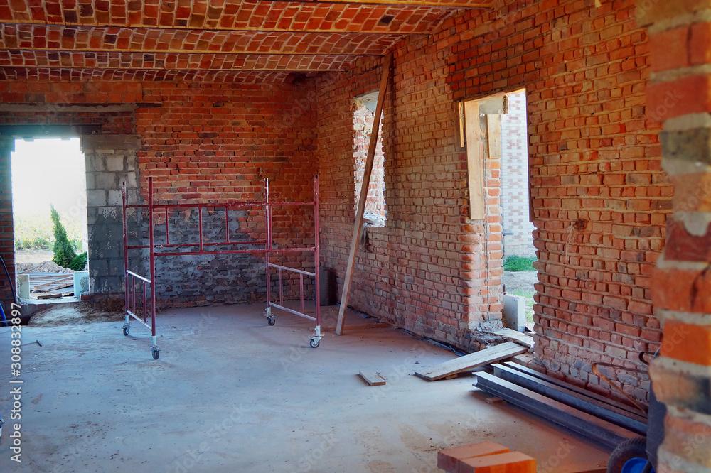 Obraz na płótnie Budowa, remont domu z czerwonej cegły w stylu loft i rustykalnym, w salonie