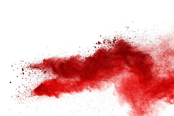 Red powder explosion on white background. Colored cloud. Colorful dust explode. Paint Holi.