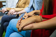 © Sathaporn - Close up hand holding hand together , Group psychotherapy session scene