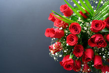 A Gift Of A Bouquet Of Roses On Black Background And Place For Your Text	
