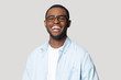 Joyful happy african american young man in eyeglasses portrait.