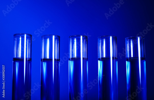 Test tubes with samples on color background