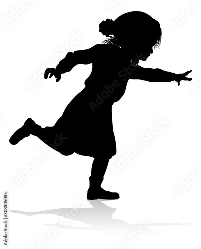 A child in silhouette playi...