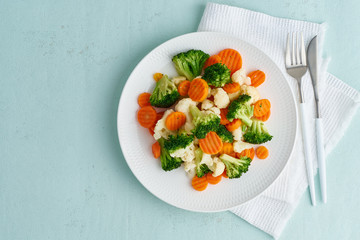 Wall Mural - Mix of boiled vegetables. Broccoli, carrots, cauliflower. Steamed vegetables for dietary low-calorie diet. FODMAP, dash diet, vegan, vegetarian