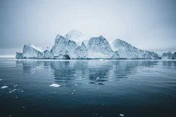iceberg and ice from glacier in arctic nature landscape in ilulissat,greenland. aerial drone photo o
