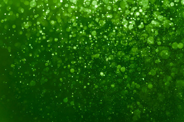 Wall Mural - abstract green bokeh defocus glitter blur background.