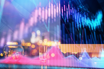 Financial graph colorful drawing and table with computer on background. Double exposure. Concept of international markets.