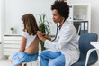 © lordn - Doctor examining child with stethoscope. Respiratory disease diagnostics and treatment
