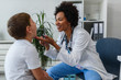 © lordn - Woman  doctor general practitioner examining child's sore throat