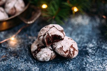 Chocolate Crinkle Cookies on a blue table. New Year, Christmas