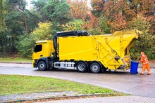 Urban Recycling Waste And Garbage Services , Bright Yellow Truck
