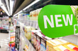 © ThamKC - New word signage on supermarket shelf for new product arrival
