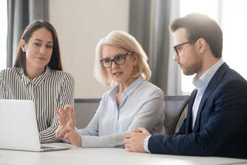 Poster - Middle-aged businesswoman talk explain issue to diverse colleagues