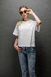 © 4Max - Sexy woman or girl wearing white blank t-shirt with space for your logo, mock up or design in casual urban style