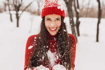 Wall Mural - smiling woman having fun in winter park