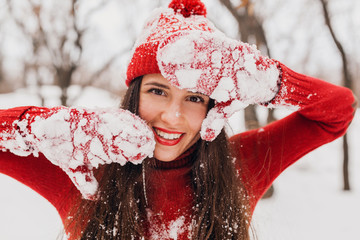 Wall Mural - smiling woman having fun in winter park