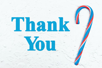 Wall Mural - Christmas thank you message with a red, white and blue candy cane